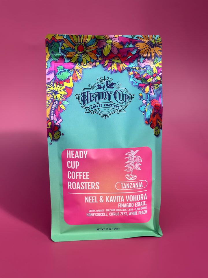 Colorful coffee bag with 'Heady Cup Coffee Roasters' branding on a pink background
