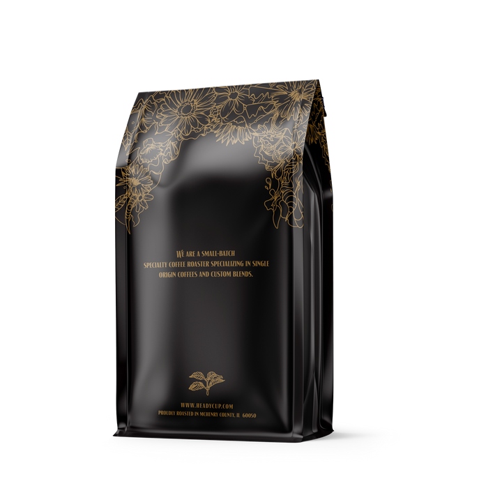 A classic black and gold floral bag of Heady Cup Coffee Roasters signature espresso roast. We are a small batch roaster specializing in single-origin coffee and custom blends. 
