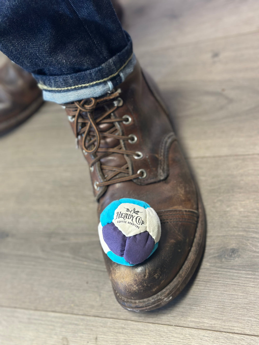 Heady Cup Coffee Roasters Foot Bag pictured on a work boot