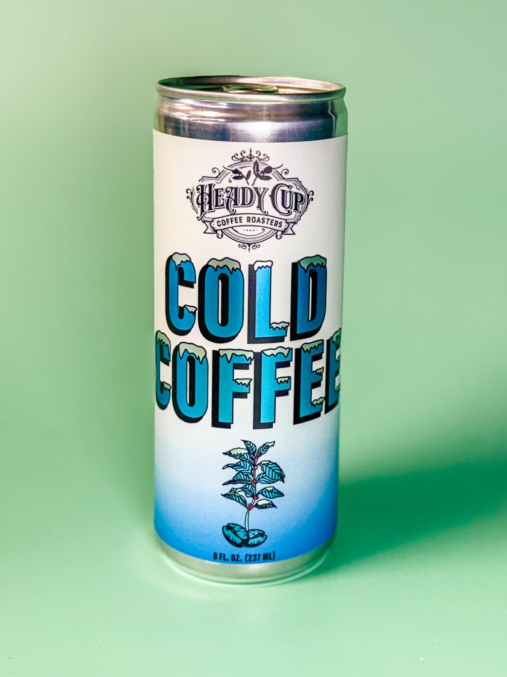 Can of Heady Cup Coffee Roasters cold coffee on a green background