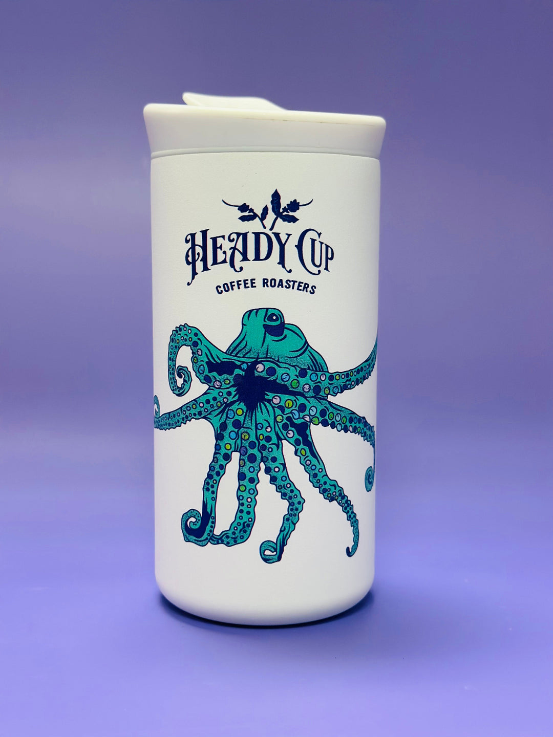 White CreatedCo NOMAD tumbler with blue octopus design and 'Heady Cup Coffee Roasters' branding 