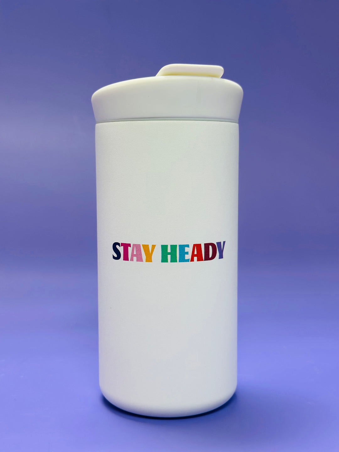 White CreatedCo NOMAD tumbler with STAY HEADY written colorfully on the back and 'Heady Cup Coffee Roasters' 