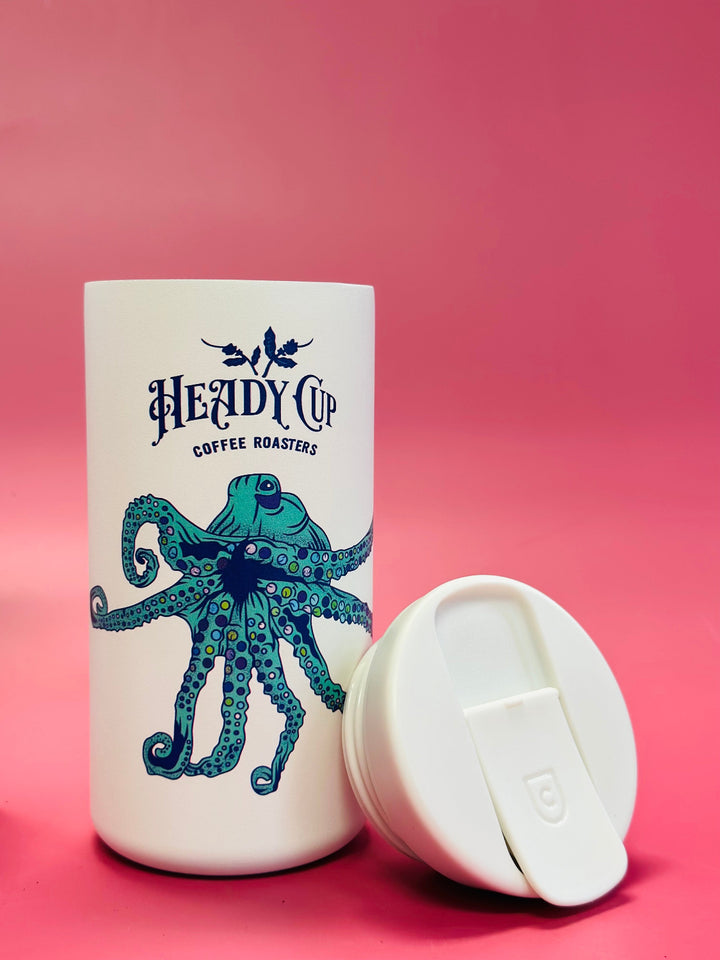 White CreatedCo NOMAD tumbler with blue octopus design and 'Heady Cup Coffee Roasters' branding 