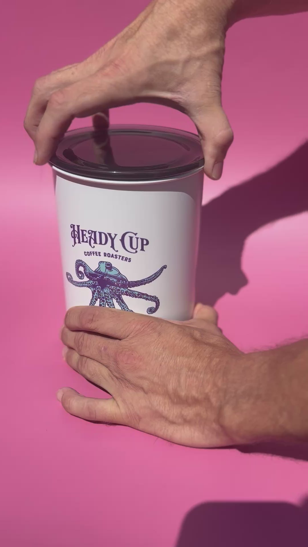 The Lid being removed from a heady Cup Coffee Roasters Airscape container.