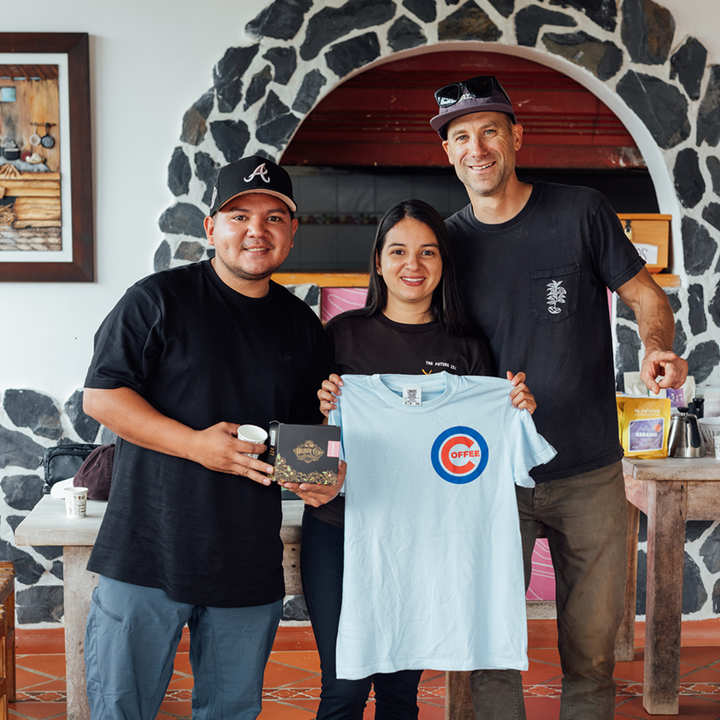 Michael Kivland, Yessica, and Diego Parra sharing a moment of gratitude amongst friends. 